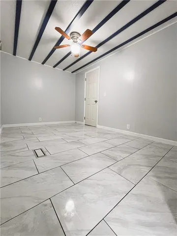 a kitchen with granite countertop a stove sink and cabinets