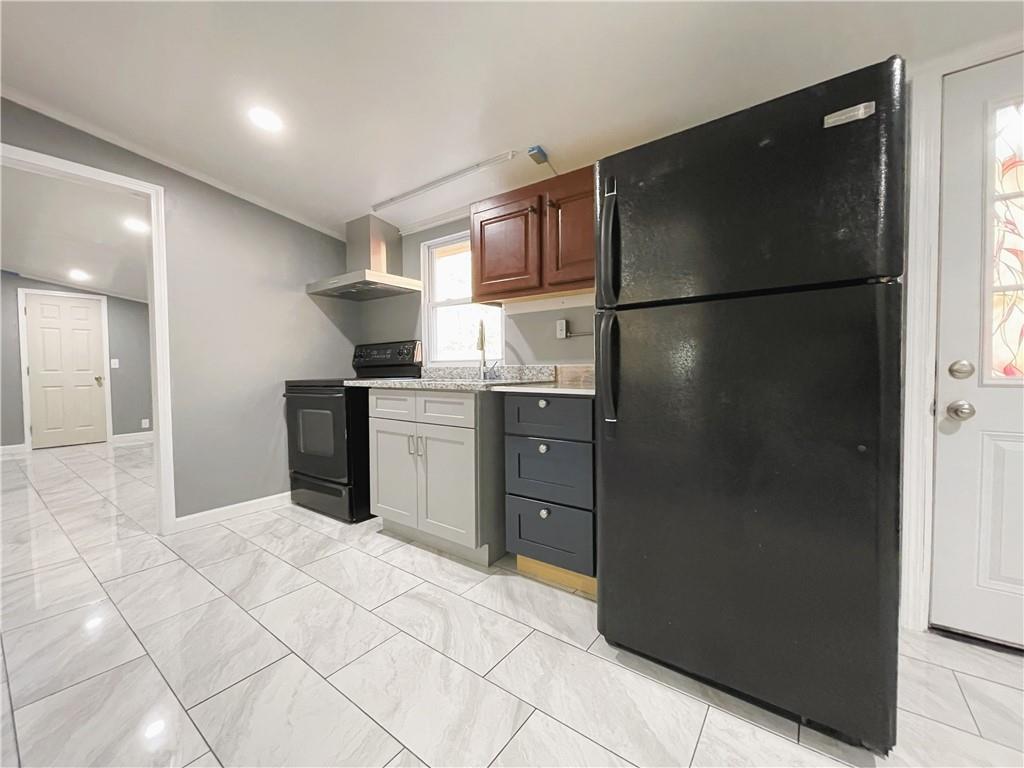 6225 Lollis Creek Road Flowery Branch, GA 30542 - Photo 28 of 36 a kitchen with stainless steel appliances granite countertop a refrigerator and a sink