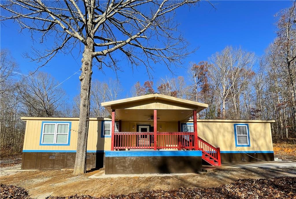 6225 Lollis Creek Road Flowery Branch, GA 30542 - Photo 3 of 36 a view of street with sitting area