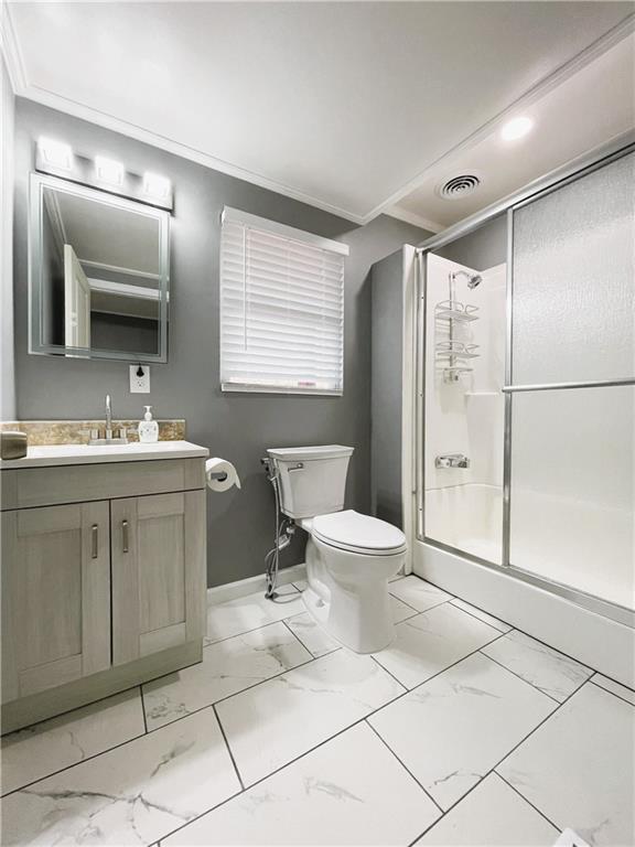 6225 Lollis Creek Road Flowery Branch, GA 30542 - Photo 31 of 36 a bathroom with a sink toilet and shower