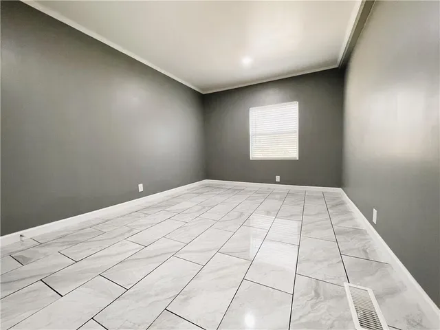 a view of a house with a wooden fence