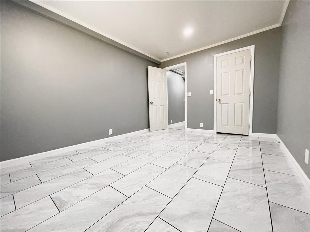 6225 Lollis Creek Road Flowery Branch, GA 30542 - Photo 33 of 36 a view of a livingroom with a dishwasher and a cabinets