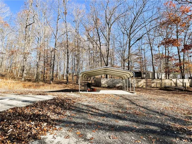 a view of a balcony with wooden floor and outdoor space