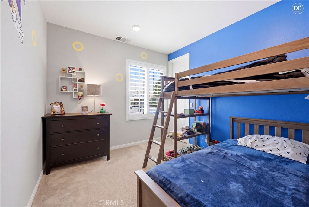 20948 Center Street Riverside, CA 92507 - Photo 64 of 92 a bed room with a bed and a book shelf