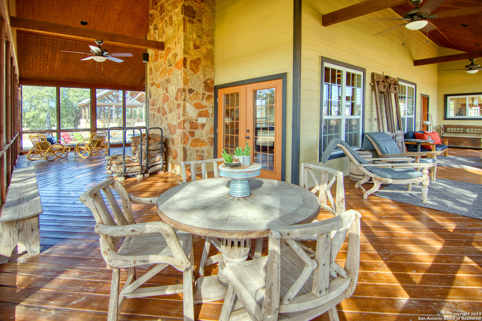 19316 Ranch Road 1871 Mason, TX 76856 - Photo 17 of 37 a dining room with furniture a chandelier and wooden floor