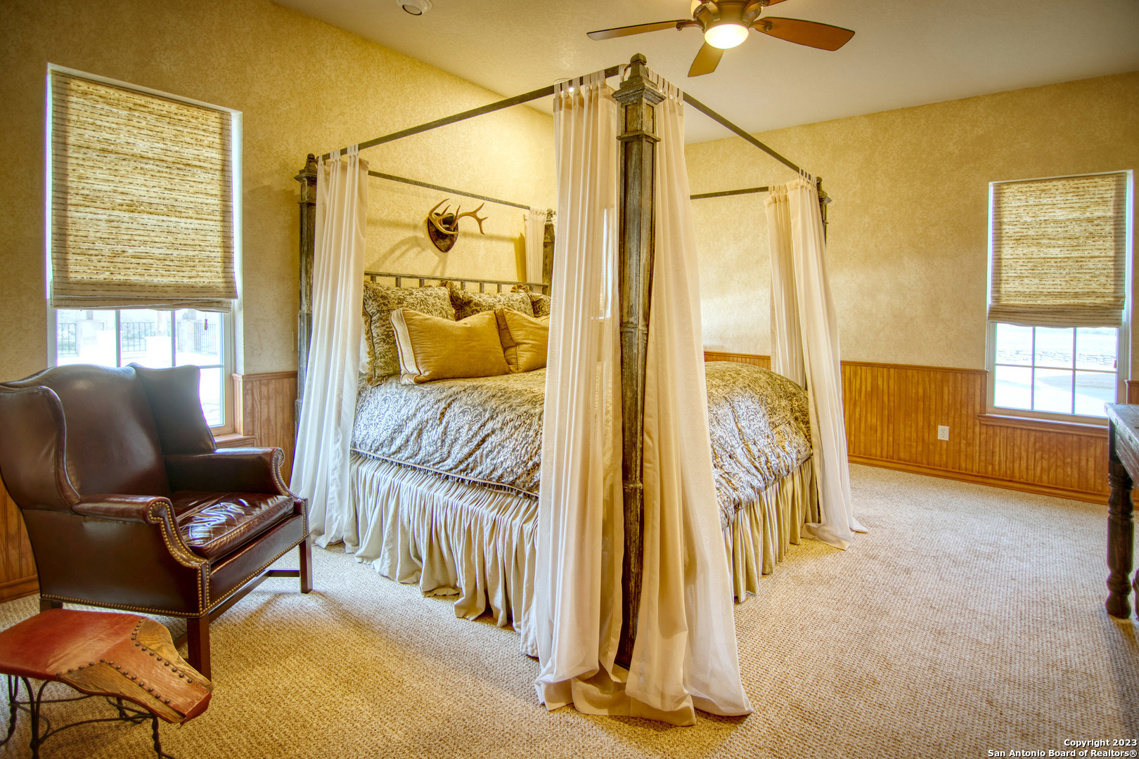 19316 Ranch Road 1871 Mason, TX 76856 - Photo 23 of 37 a bedroom with a bed and a chandelier