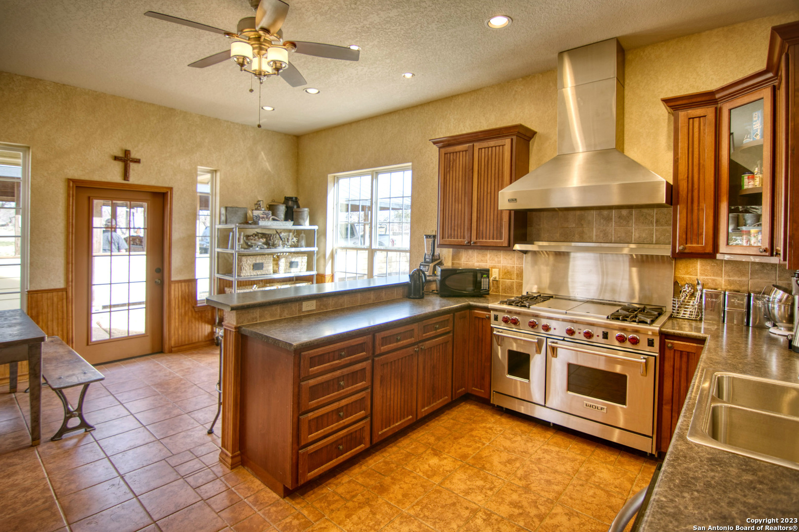19316 Ranch Road 1871 Mason, TX 76856 - Photo 24 of 37 a kitchen with stainless steel appliances granite countertop a stove and a sink