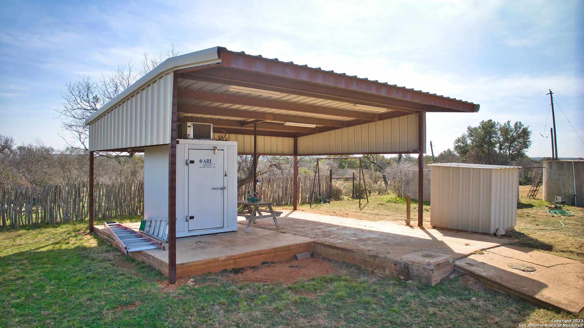 19316 Ranch Road 1871 Mason, TX 76856 - Photo 5 of 37 a backyard of a house with a tub and trees