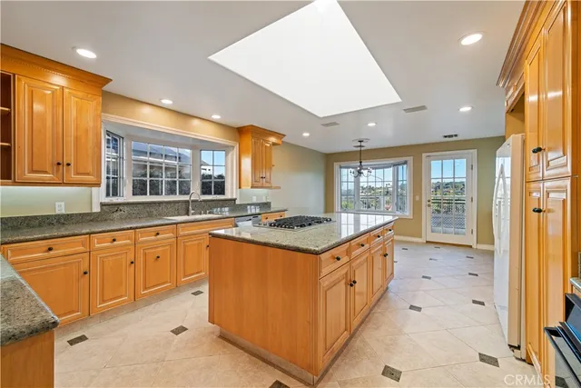 a large kitchen with a table and chairs