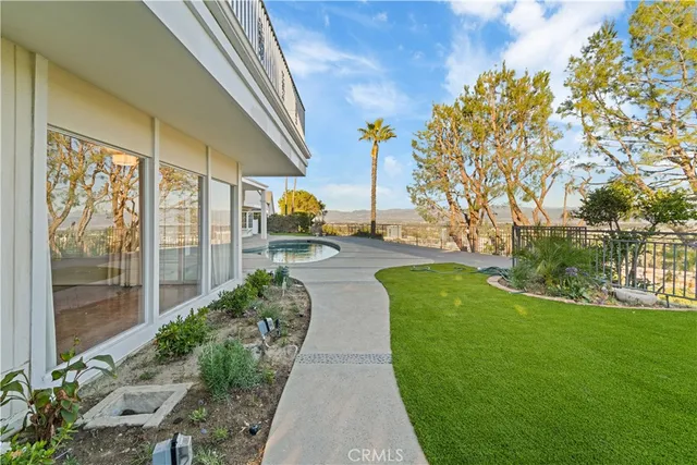 an aerial view of a house with outdoor space