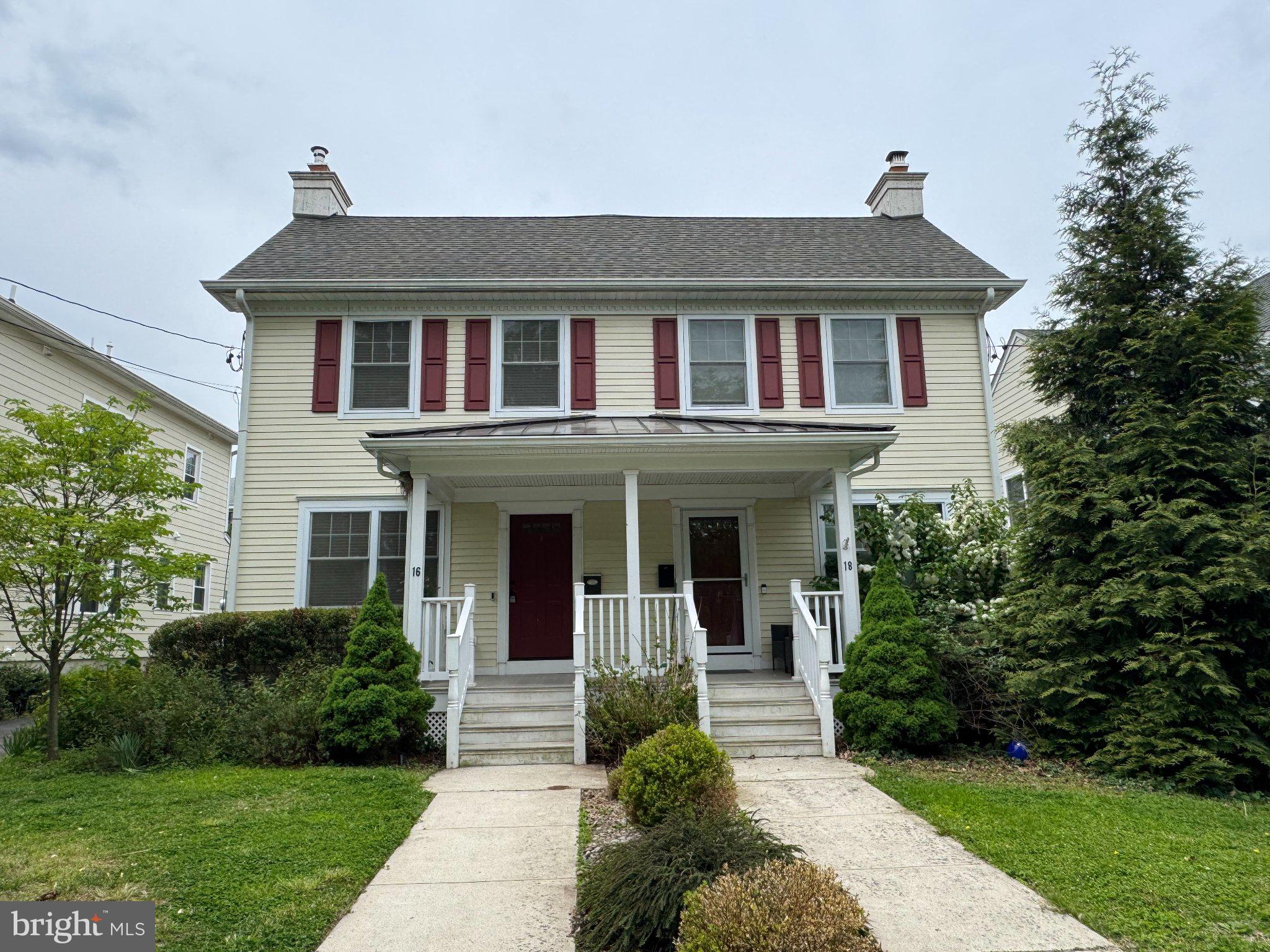 Charming duplex with inviting porch.