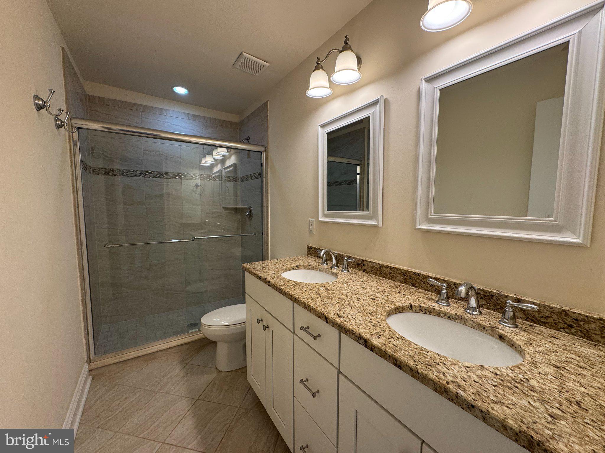 16 Harris Road Princeton, NJ 08540 - Photo 20 of 25 Elegant dual-sink bathroom retreat.