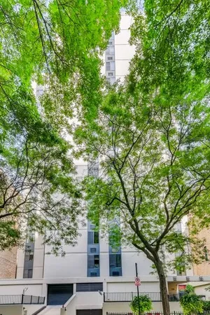 an outdoor view of house with green space