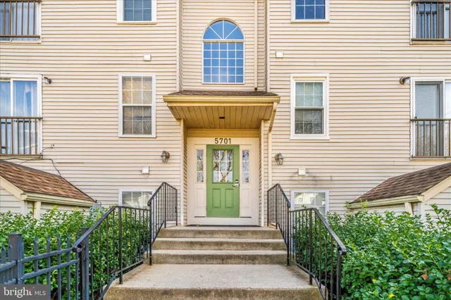 a front view of a house with a porch