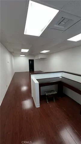 a room with stairs and a wooden floor