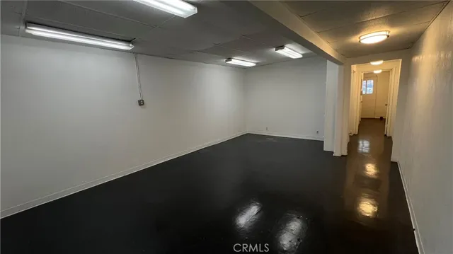 a view of a storage & utility room with a window