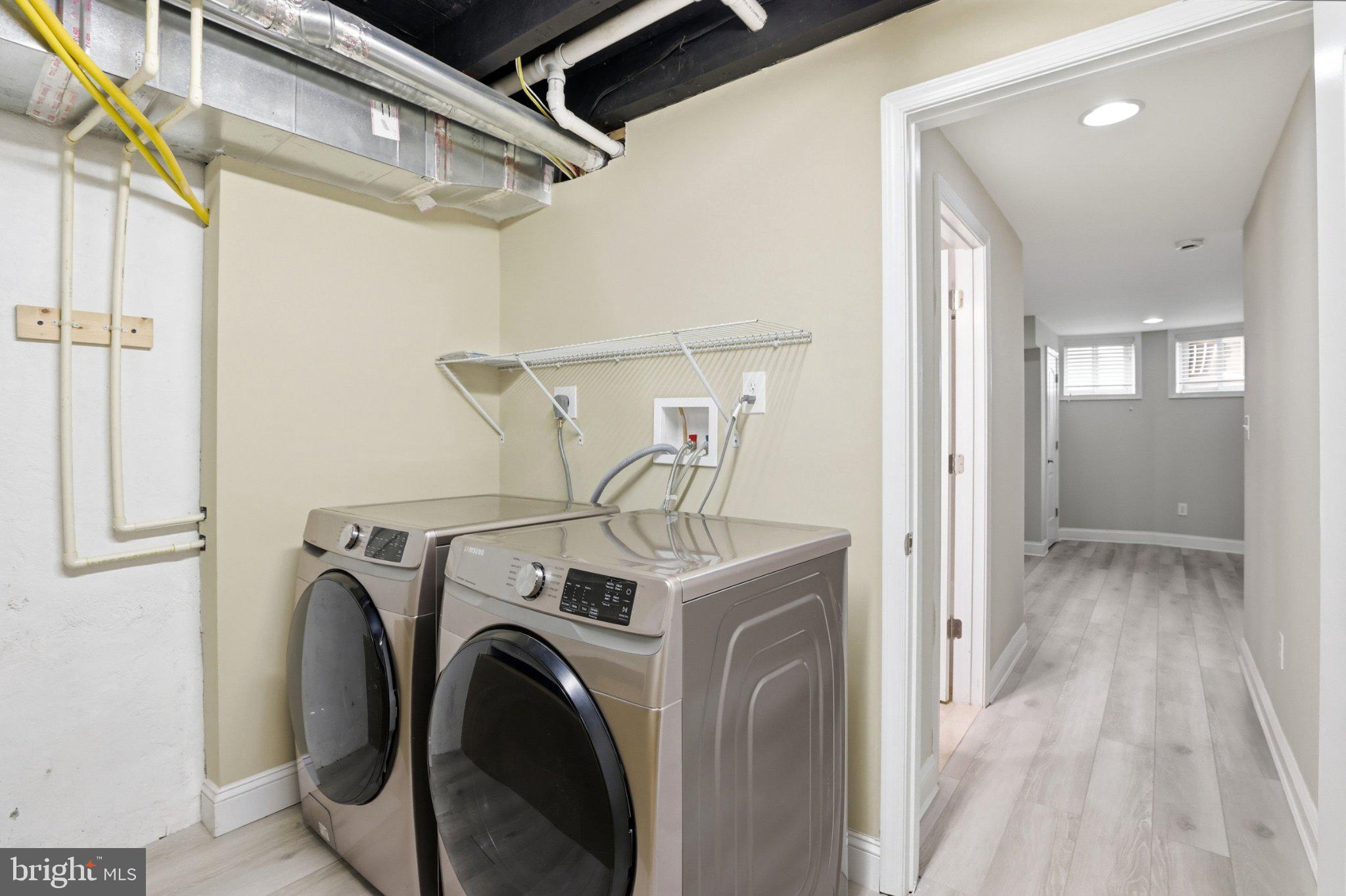 222 South Exeter Street Baltimore, MD 21202 - Photo 28 of 41 a view of a storage & utility room with dryer and washer