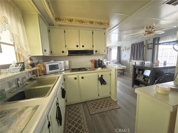 a kitchen that has a sink and a stove
