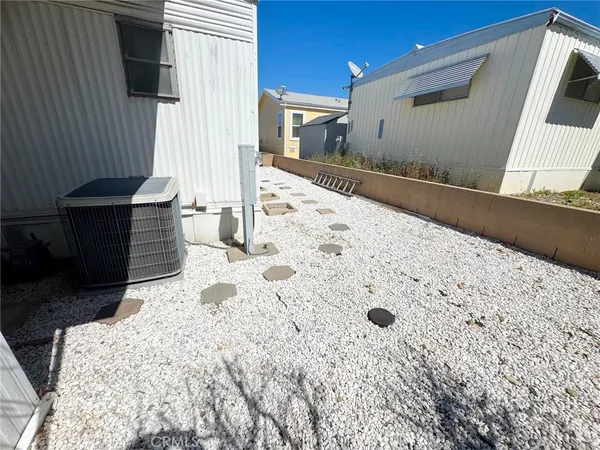 a view of a backyard of the house