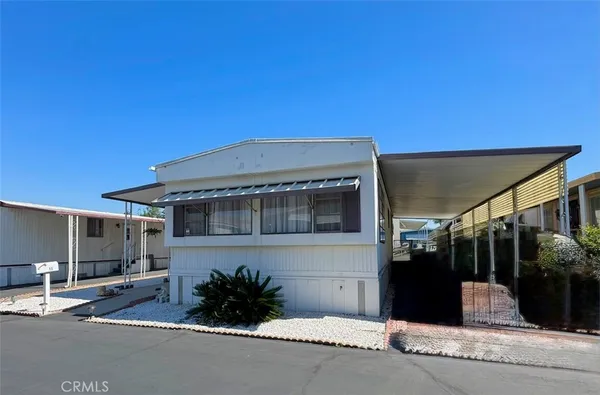 a picture of a building with a yard