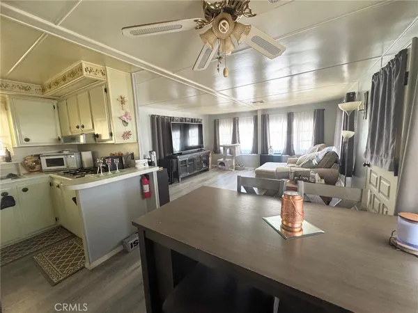 a very nice looking dining room with a large window