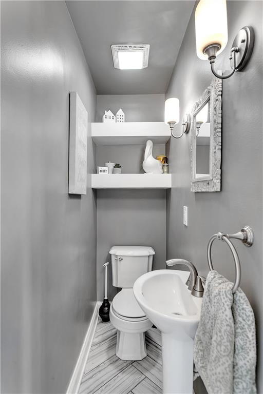 1560 2nd Street Beaver, PA 15009 - Photo 19 of 37 a bathroom with a toilet sink and mirror