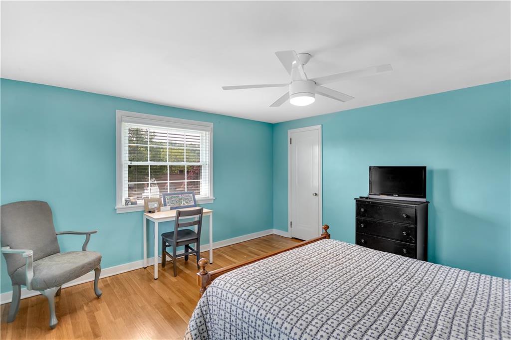 1560 2nd Street Beaver, PA 15009 - Photo 22 of 37 a bedroom with a bed and a chair