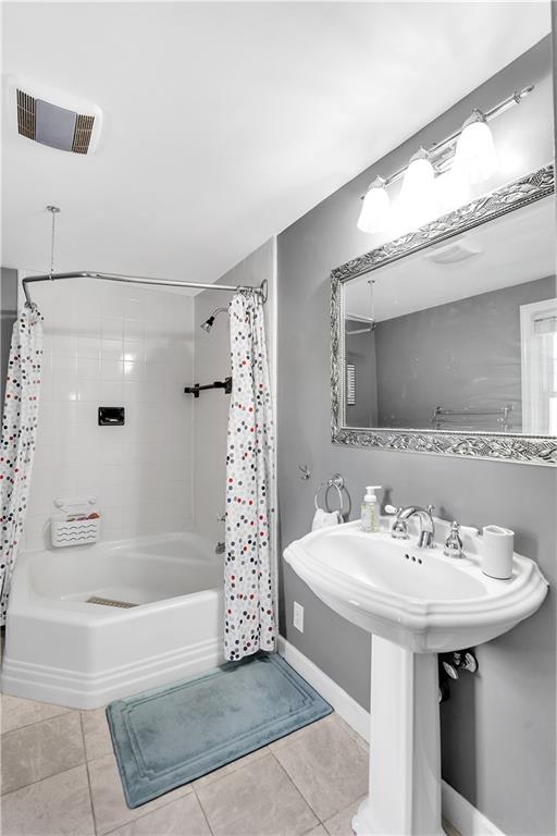 1560 2nd Street Beaver, PA 15009 - Photo 23 of 37 a bathroom with a sink a mirror and a bathtub