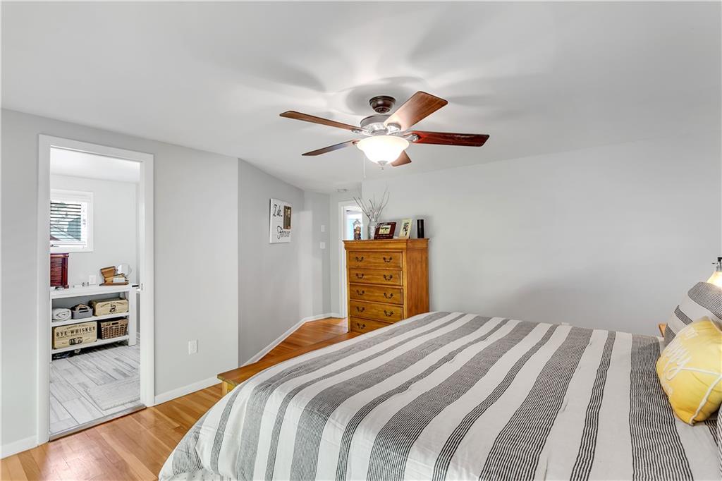 1560 2nd Street Beaver, PA 15009 - Photo 25 of 37 a bedroom with a bed a dresser and wooden floor