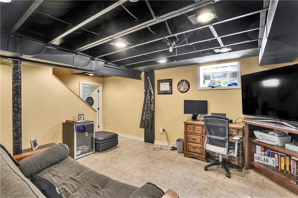 1560 2nd Street Beaver, PA 15009 - Photo 31 of 37 a room with furniture and a flat screen tv