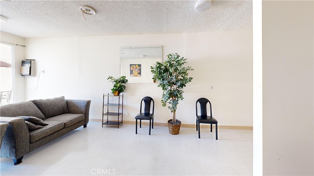 14569 Benefit Street, Unit 102 Sherman Oaks, CA 91403 - Photo 21 of 24 a living room with furniture and potted plant
