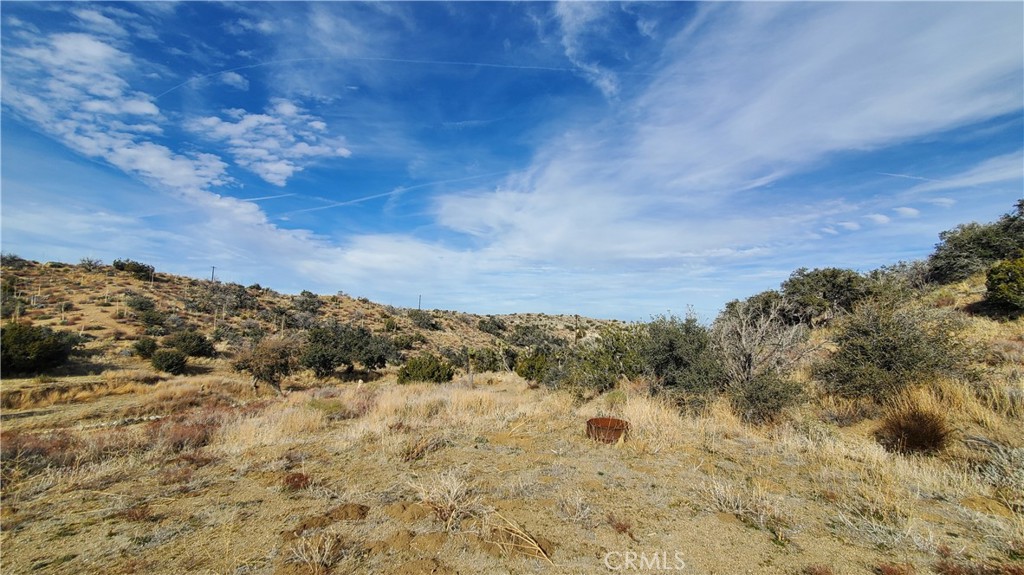 0 Vicinity Ross Road East Juniper Hills, CA 93543 - Photo 34 of 50 a view of a building with mountains in the background