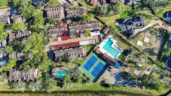 an aerial view of a building with swimming pool
