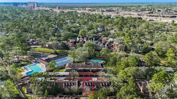 an aerial view of a houses with outdoor space
