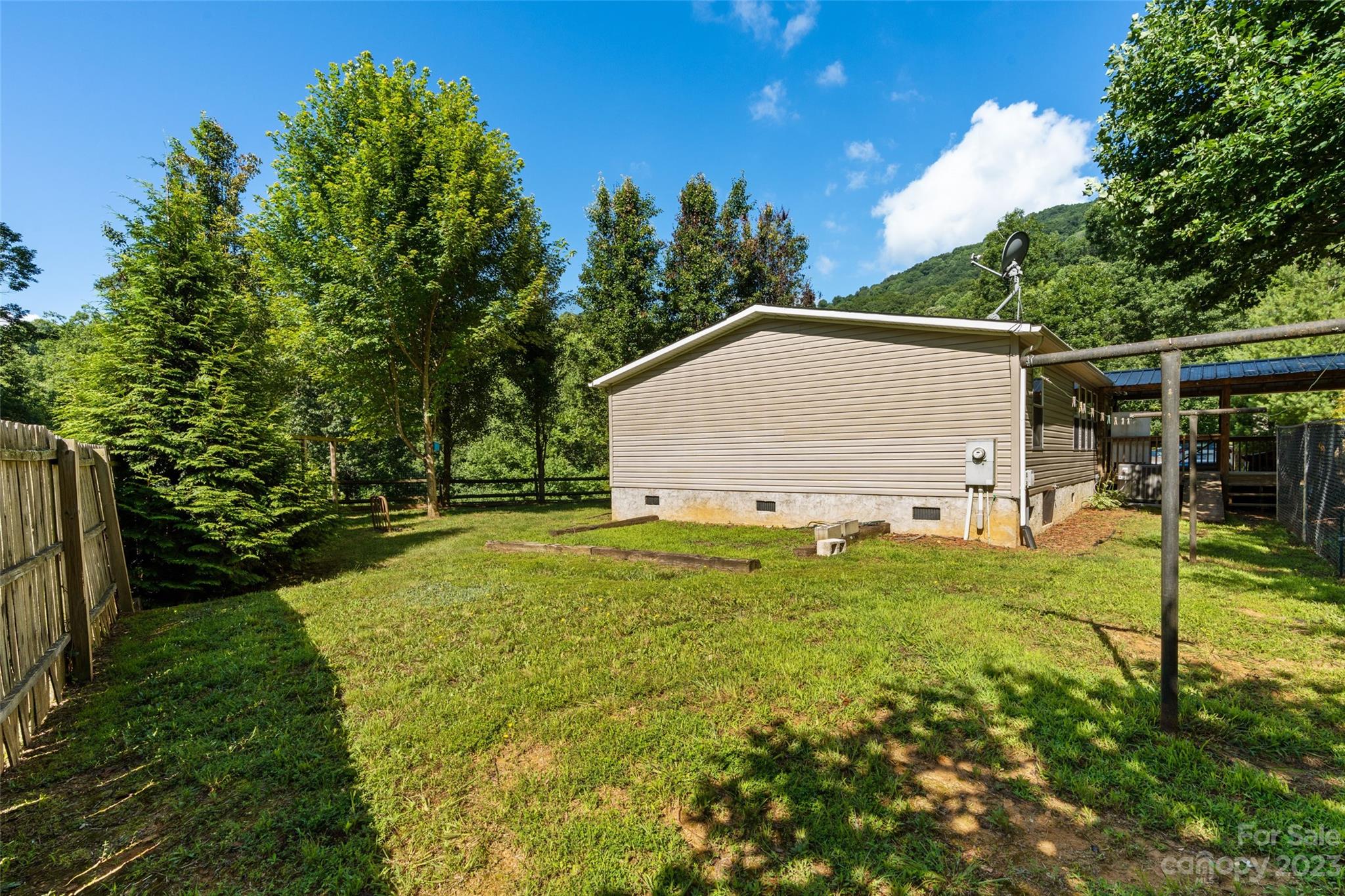 100 Lansing Road Waynesville, NC 28786 - Photo 5 of 11 a view of backyard of house and trees