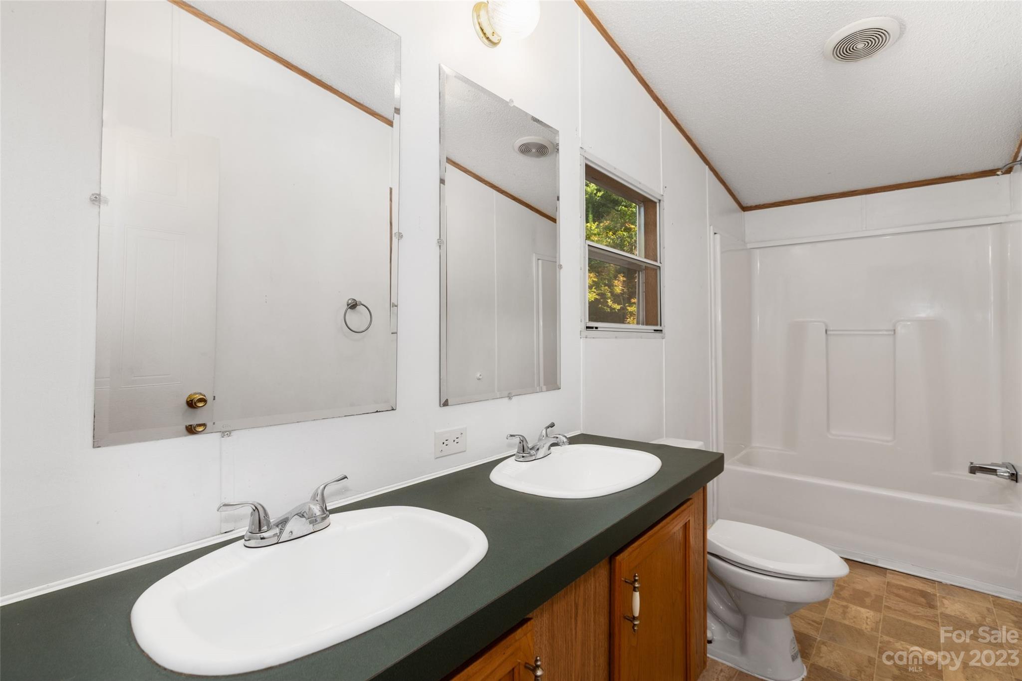 100 Lansing Road Waynesville, NC 28786 - Photo 9 of 11 a bathroom with a sink toilet and shower