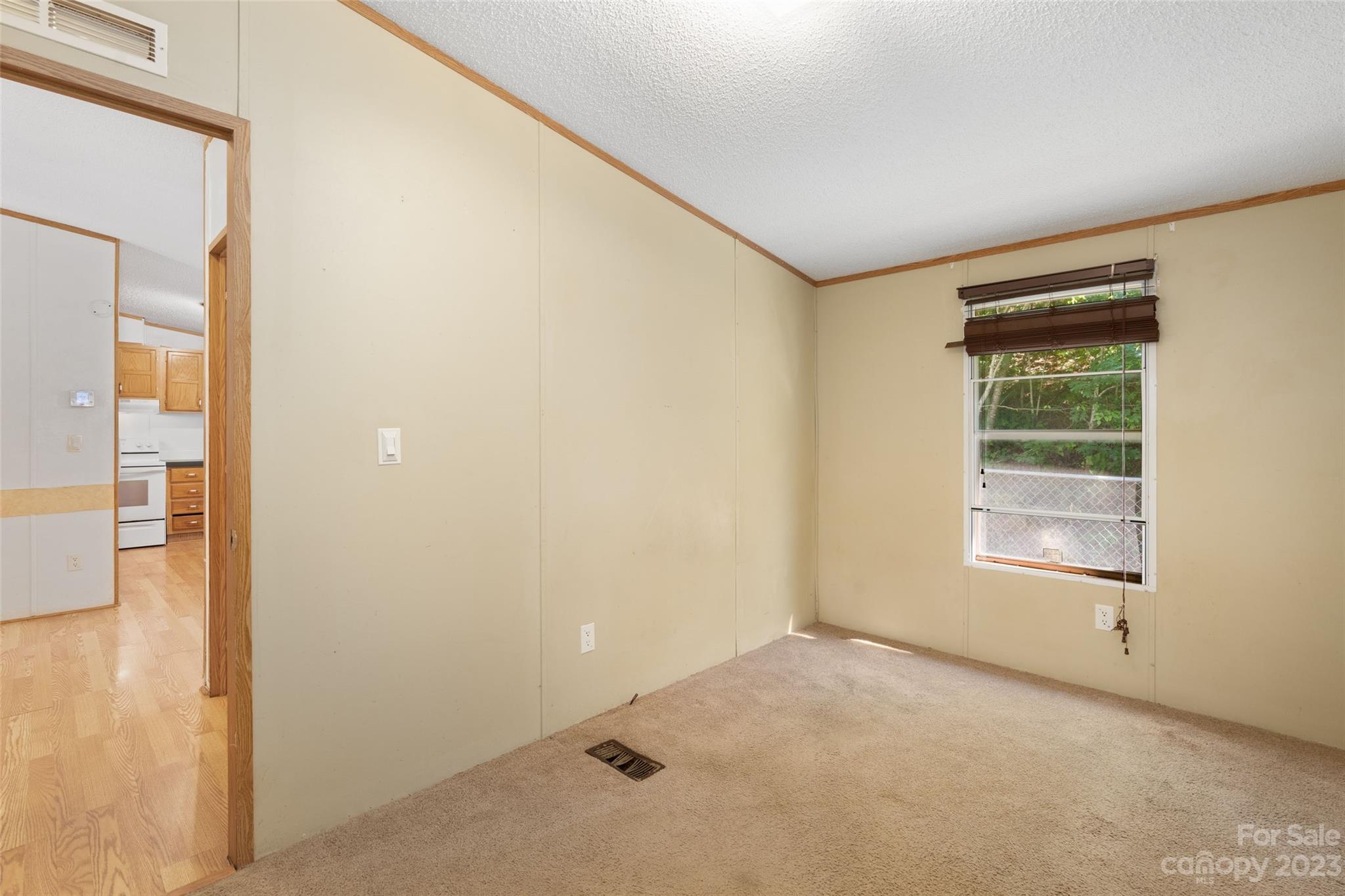 100 Lansing Road Waynesville, NC 28786 - Photo 10 of 11 a view of an empty room with a window