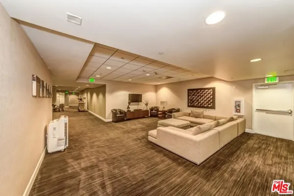 a spacious bedroom with a bed and a table