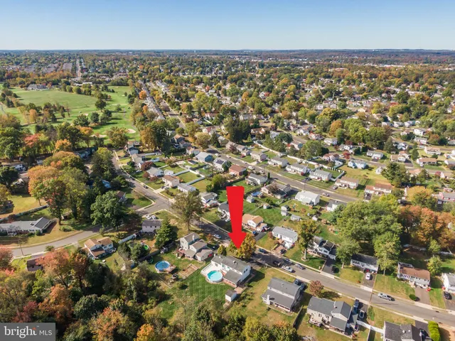 an aerial view of residential building with trees