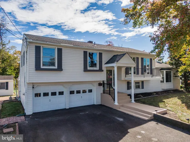 a view of a house with wooden floor in front of house