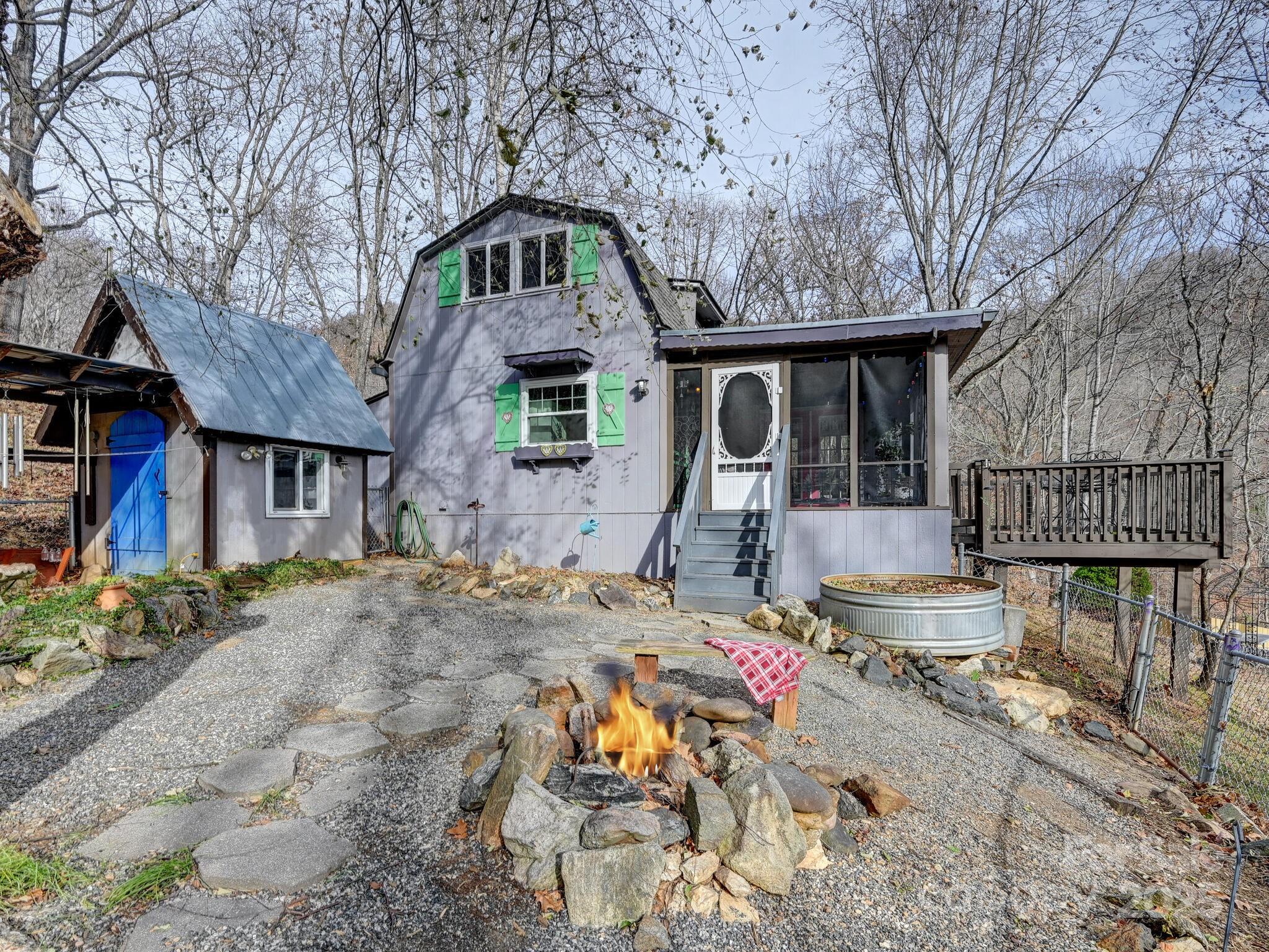 a front view of house with yard outdoor seating and barbeque oven
