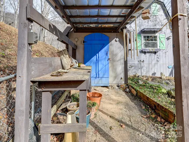 a room with stainless steel appliances kitchen island granite countertop a stove and a refrigerator