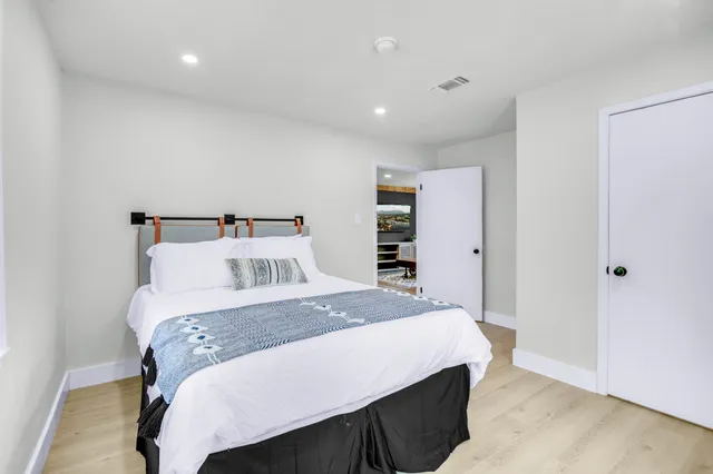 a bedroom with a bed and a closet