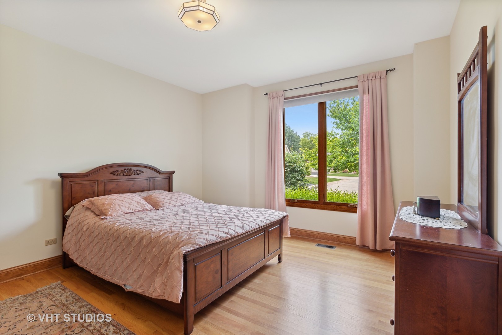 6 Olympic Court Lake In The Hills, IL 60156 - Photo 14 of 32 a bed sitting in a bedroom next to a window