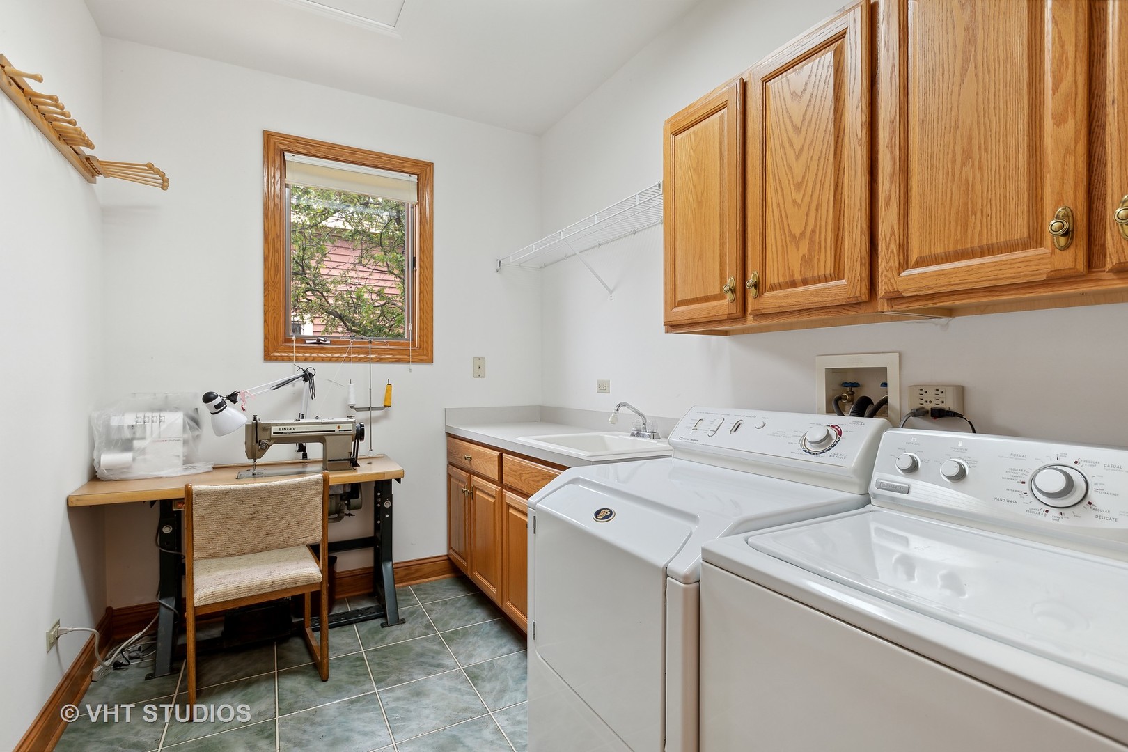 6 Olympic Court Lake In The Hills, IL 60156 - Photo 10 of 32 a utility room with dryer washer and a sink