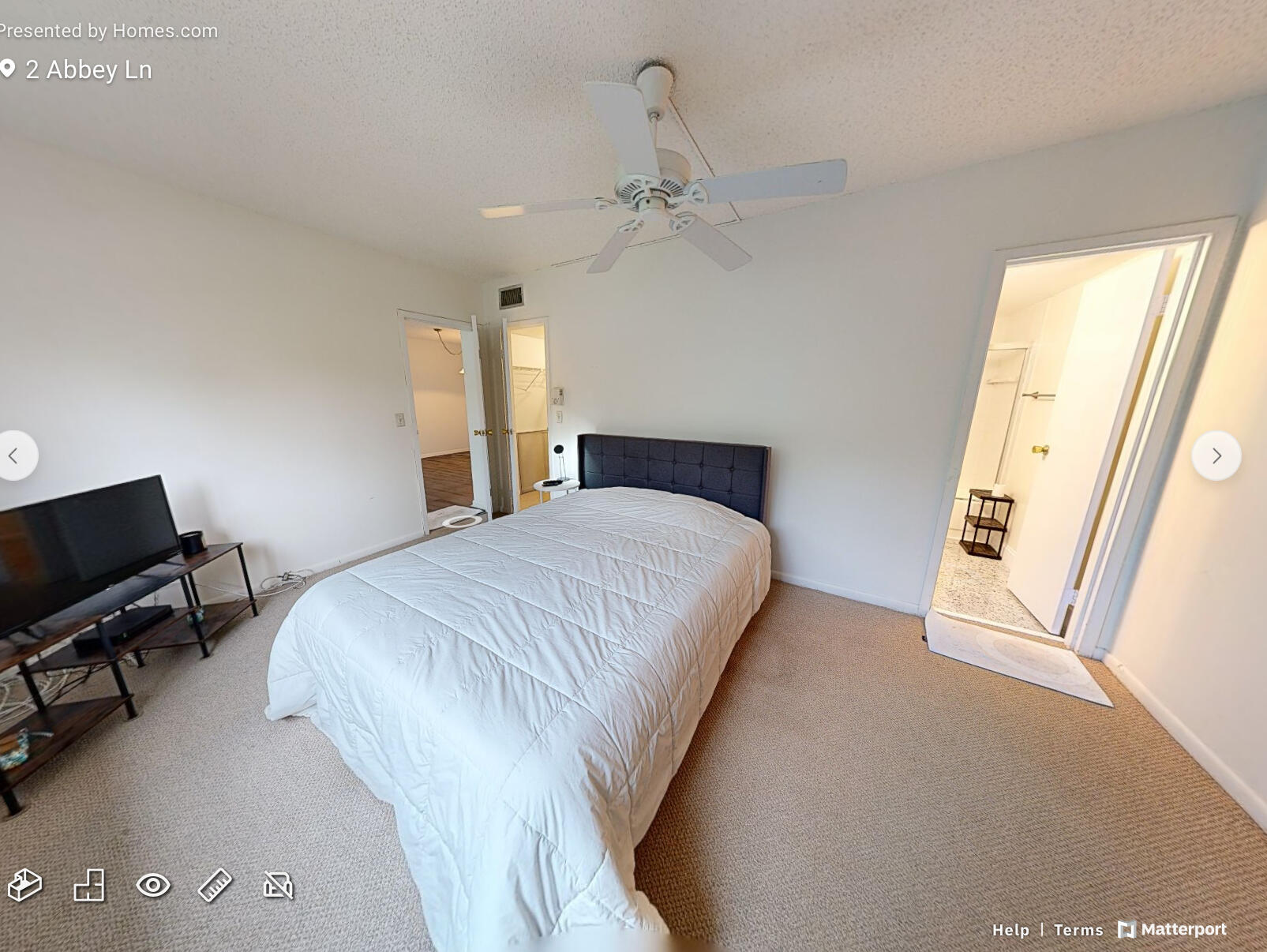 2 2 Abbey Lane, Unit 203 Delray Beach, FL 33446 - Photo 11 of 22 a bedroom with a bed dresser and a window