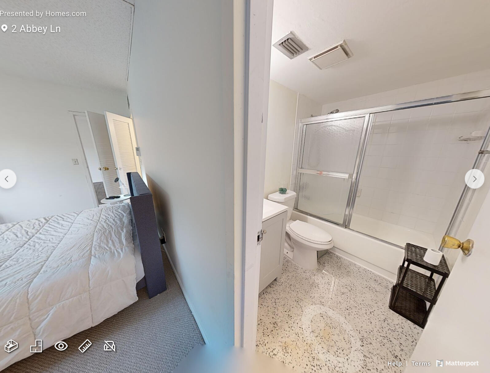 2 2 Abbey Lane, Unit 203 Delray Beach, FL 33446 - Photo 12 of 22 a bathroom with a sink and a mirror