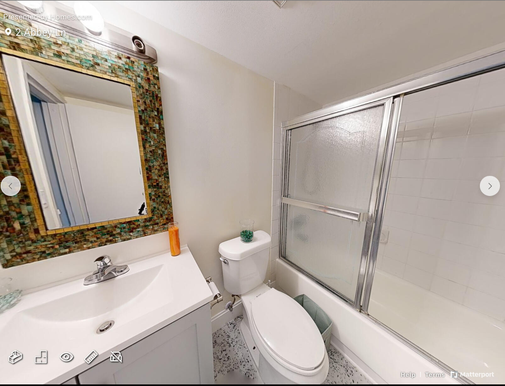 2 2 Abbey Lane, Unit 203 Delray Beach, FL 33446 - Photo 13 of 22 a white toilet sitting next to a bathroom sink