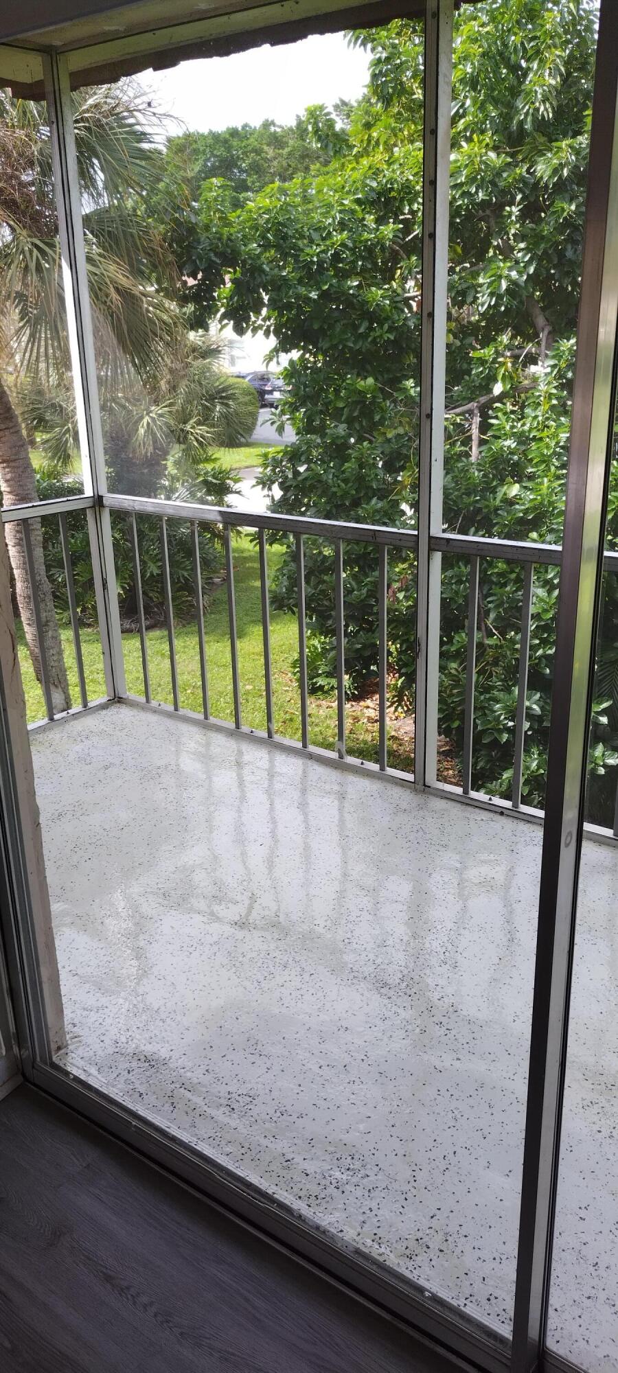 2 2 Abbey Lane, Unit 203 Delray Beach, FL 33446 - Photo 20 of 22 a view of outdoor space with swimming pool