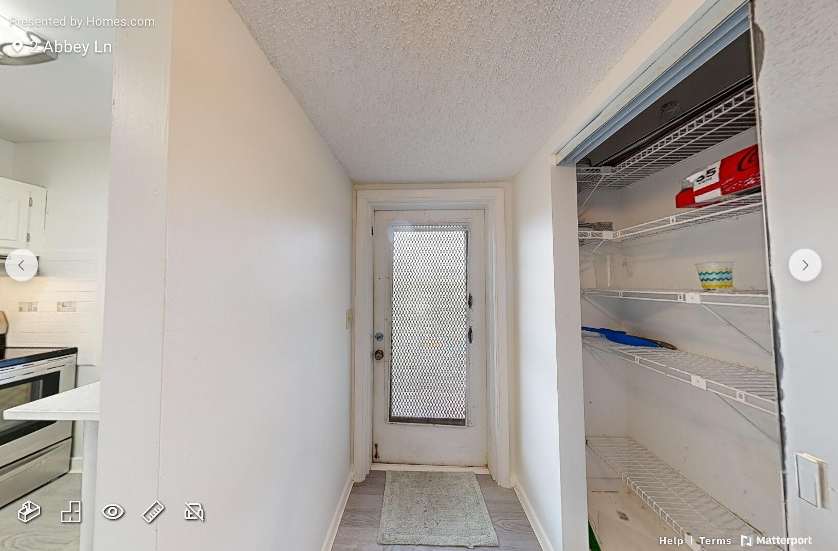 2 2 Abbey Lane, Unit 203 Delray Beach, FL 33446 - Photo 7 of 22 a view of a closet area
